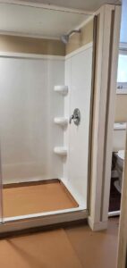 A newly installed shower stall with modern fixtures by Constructed by 360 LLC in Meridian, ID.