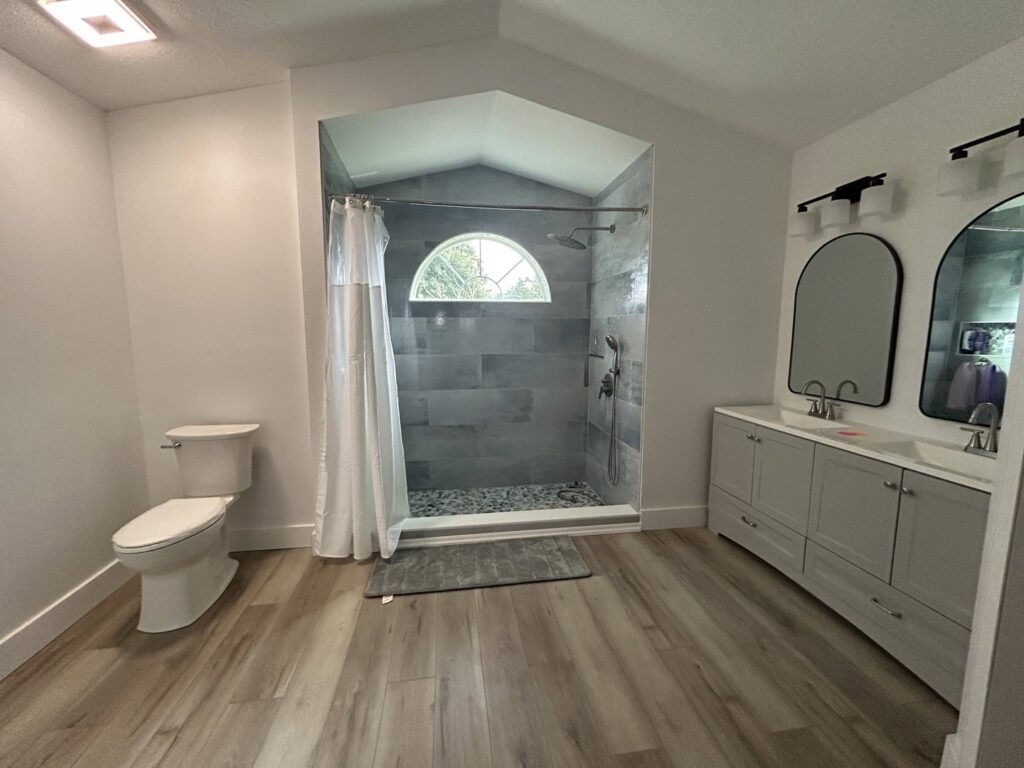 Bathroom shower area with waterproofing applied during renovation by Modern Construction Group Inc. in Orlando, FL.