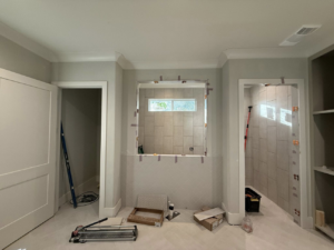 Bathroom wall tile installation by Milton Hebert Construction, a handyman service in Lafayette, LA.