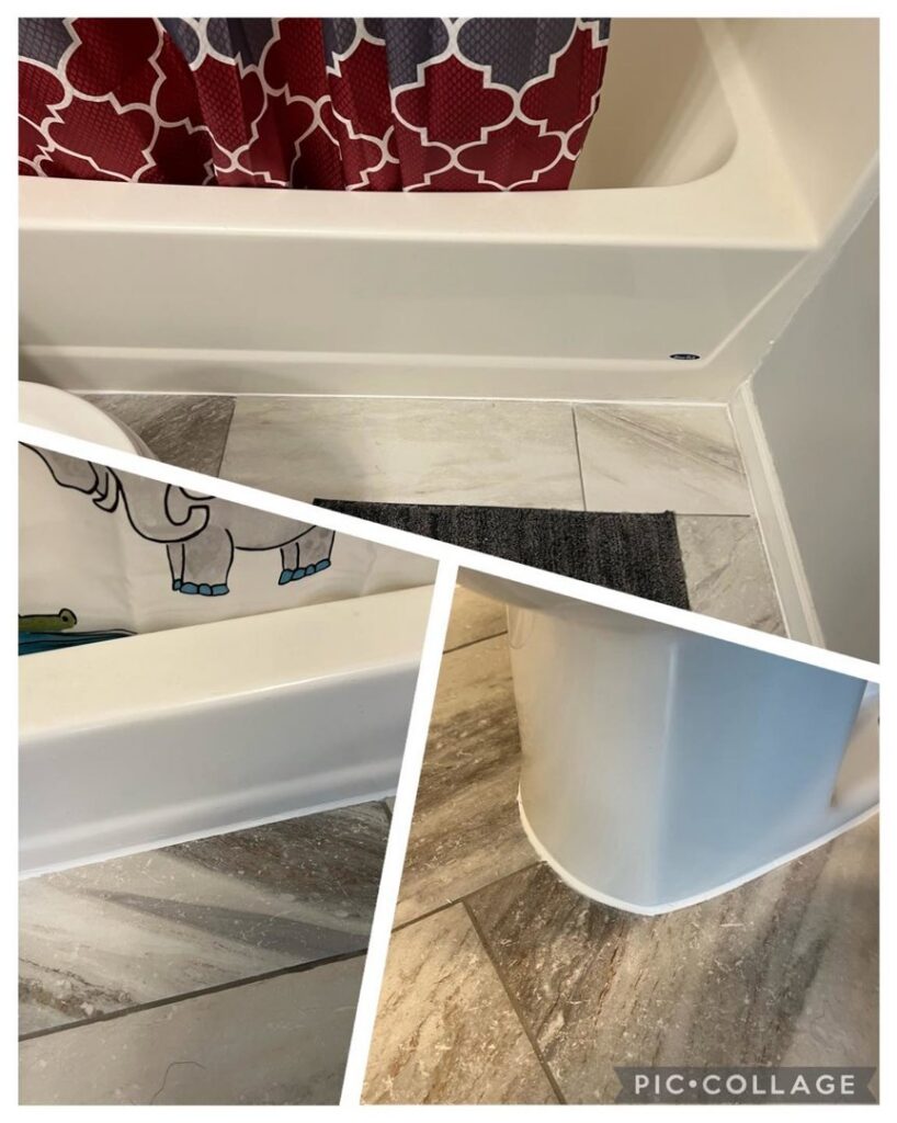 Close-up of new baseboard trim and caulking installed around a bathtub and toilet by Med City Handy Ma'am in Rochester, MN