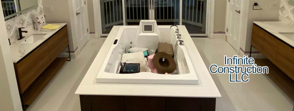 A large built-in bathtub installation in a spacious bathroom by Infinite Construction LLC in Bristol, CT.