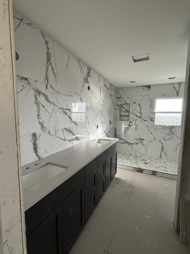 Bathroom renovation with new vanity and marble-look tile by Gregg Hoffman Construction Inc. in Tacoma, WA