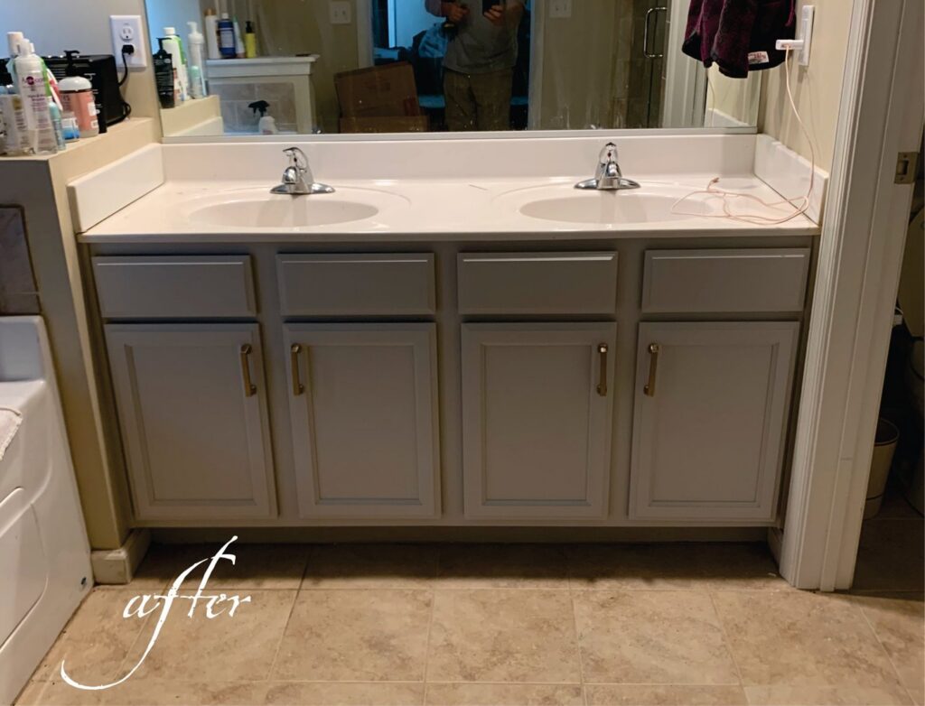 An after photo of a bathroom vanity with freshly painted gray cabinets and new hardware by Coastal Surface Design in Virginia Beach, VA.