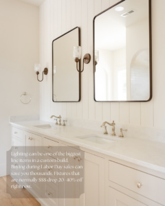 A pristine bathroom vanity with dual sinks, mirrors, and wall sconces, showcasing fixture installation by Wiersma Homes in Knoxville, TN.