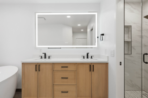 Stylish bathroom vanity next to a glass shower entrance, expertly installed by BelRed Construction in Bellevue, WA.