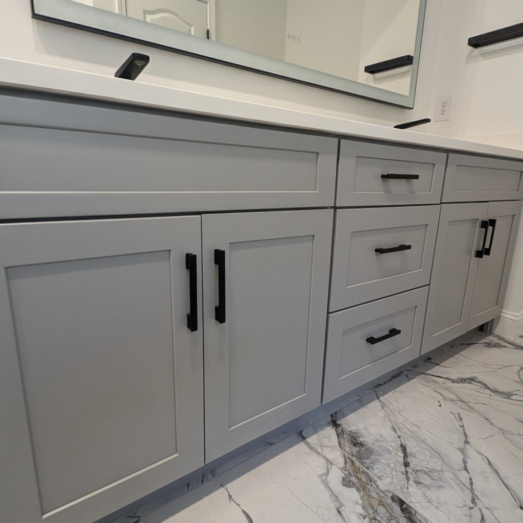 Modern gray bathroom vanity with black hardware installed by Ensotile - Atlanta Bathroom Remodeling in Stone Mountain, GA