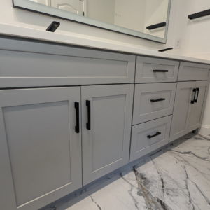 Modern gray bathroom vanity with black hardware installed by Ensotile - Atlanta Bathroom Remodeling in Stone Mountain, GA