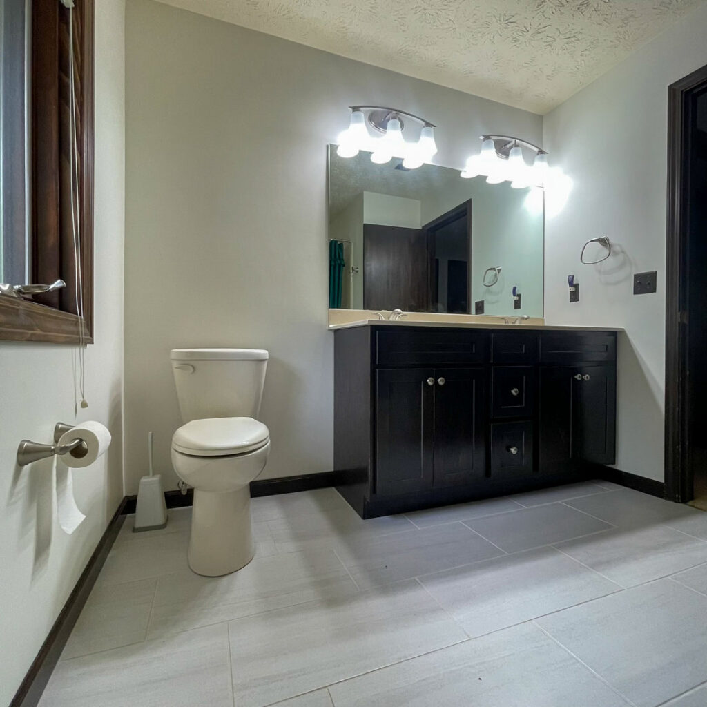 Newly installed bathroom vanity, sinks, and light fixtures by S. Brown Construction Co. in Lafayette, IN