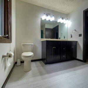 Newly installed bathroom vanity, sinks, and light fixtures by S. Brown Construction Co. in Lafayette, IN