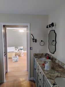 A bathroom vanity with new fixtures, part of a renovation project by Supernatural Drywall, offering handyman services in Augusta, GA