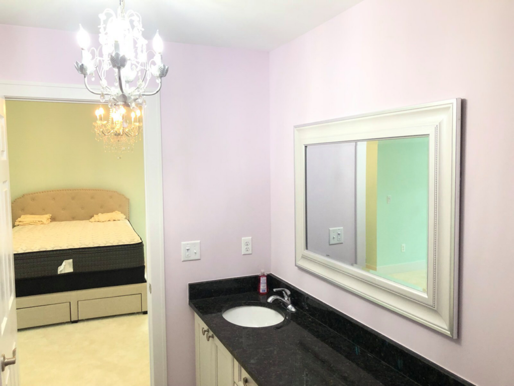 A newly installed bathroom vanity, mirror, and chandelier by Handyman Helper in Simi Valley, CA.