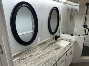 New bathroom vanity, sink, and mirror installation by W. Brian Roberts Construction in Wilmington, NC