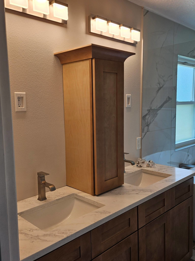 A beautifully renovated bathroom vanity area with dual sinks and custom cabinetry by Amazing Spaces 21 in Orlando, FL
