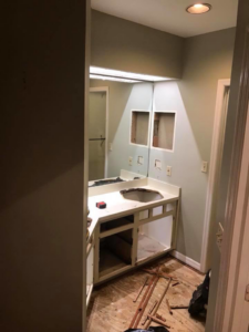 A bathroom renovation project with the vanity removed by Daley Construction, LLC in Tampa, FL.