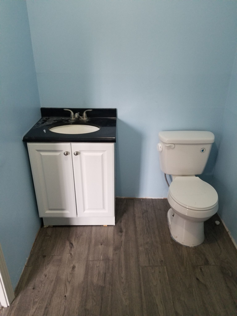 Newly installed bathroom vanity and toilet by Chris's Handyman Services in Wichita, KS