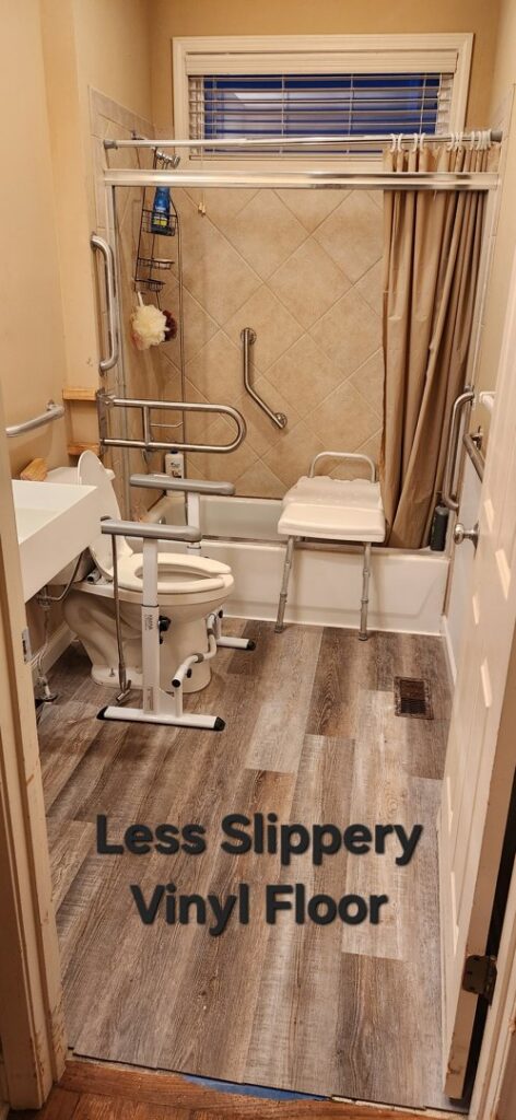 A bathroom with new less slippery vinyl flooring and accessibility upgrades, completed by Go Joe Handyman in Overland Park, KS.