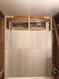 A bathroom wall prepared with cement board for tiling during a renovation by Ken Sweeney Property Solutions in Knoxville, TN