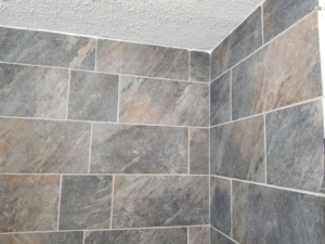 Close-up of newly installed bathroom wall tiles by Chris's Handyman Services in Wichita, KS