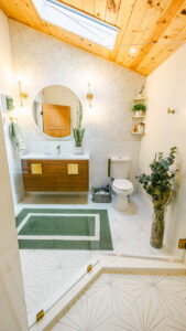 Bathroom renovation with wood ceiling and new vanity installed by Cabido Design, a handyman in Brentwood, MD.