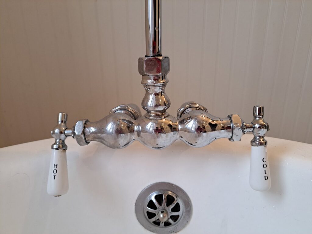 A newly installed or repaired bathtub faucet with hot and cold handles by Victor White Handyman in Long Beach, CA