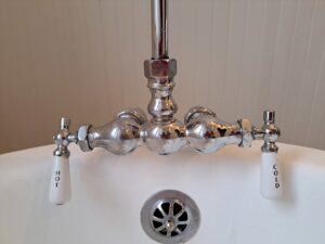 A newly installed or repaired bathtub faucet with hot and cold handles by Victor White Handyman in Long Beach, CA