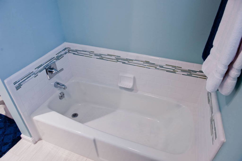 A newly installed bathtub with white subway tile surround by Glen E Stuckel Builder LLC in Louisville, KY.