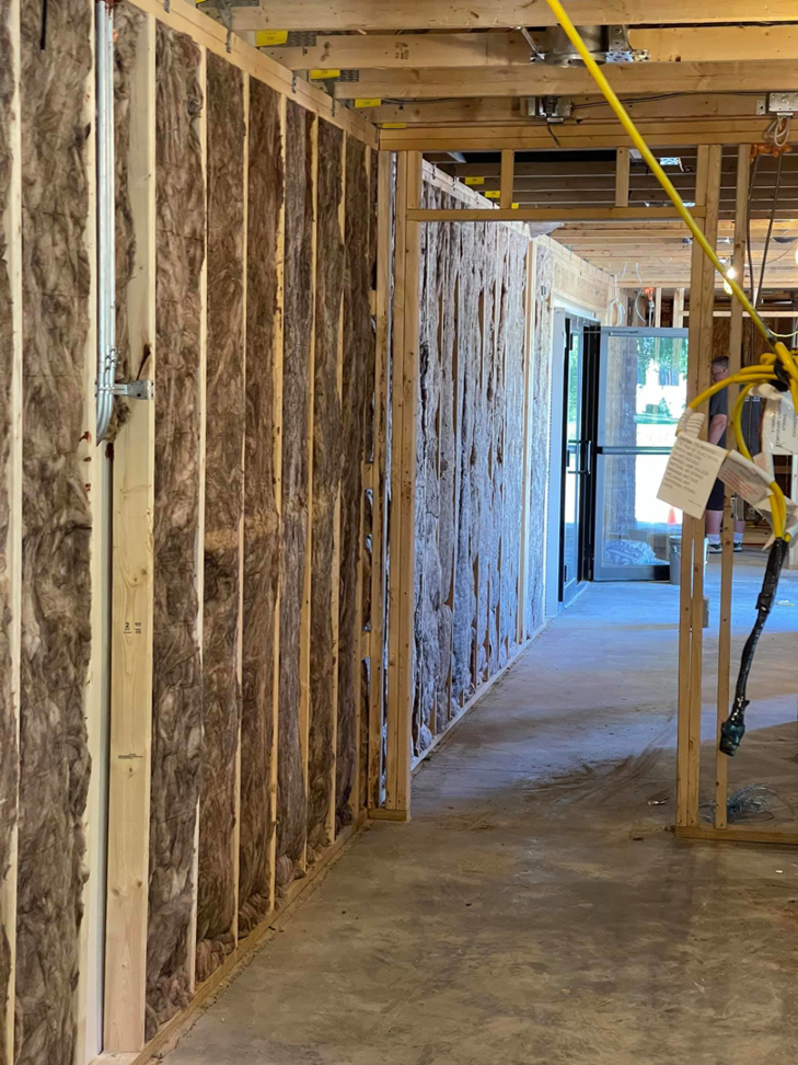 Batt insulation installed between wall studs in a new construction project by Miami Valley Insulation Co LLC in Dayton, OH.