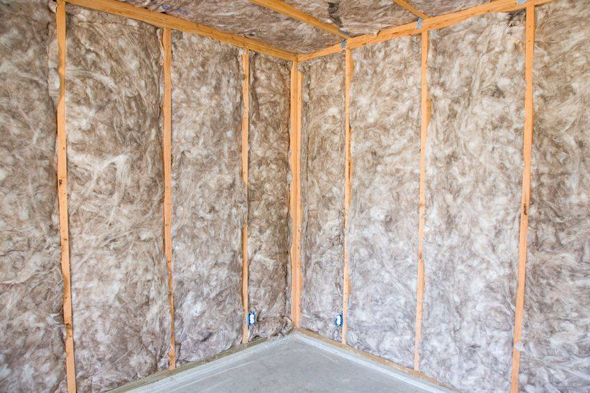 Batt insulation installed in the wall framing of a room corner by Ohio Insulation & Manufacturing Co in Dayton, OH.