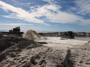 Sand and water being pumped onto a beach during a renourishment project by Gator Dredging in Clearwater, FL.