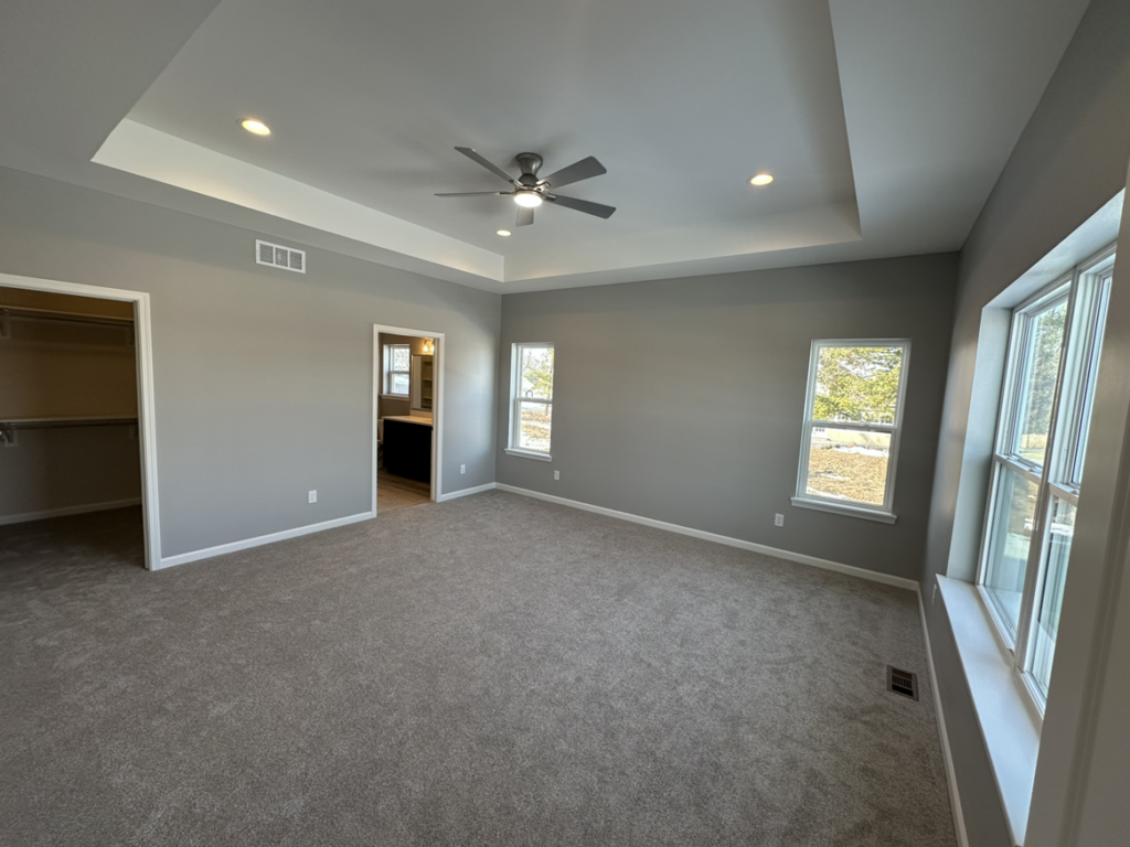 A newly installed ceiling fan in a bedroom by Harpe Development LLC in Kenosha, WI.