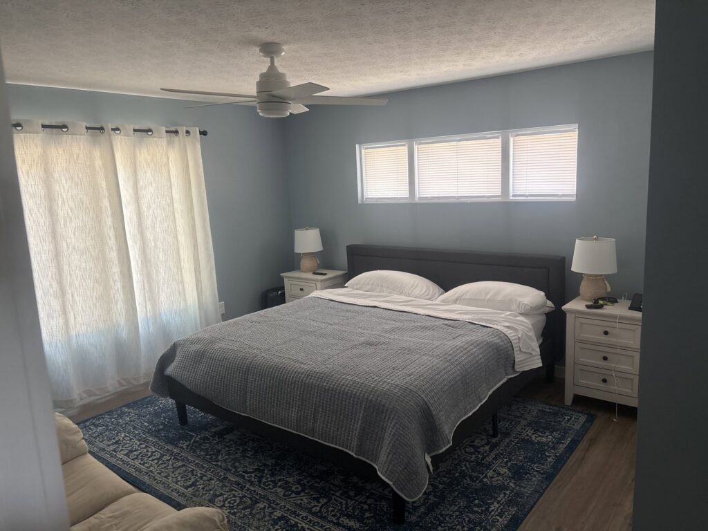 Bedroom with new ceiling fan installed by True North Builders in Franktown, CO.