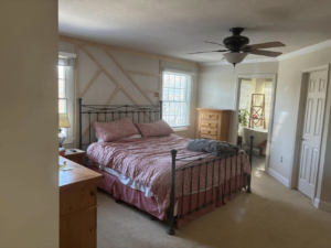 A bedroom featuring decorative wall trim installation, a project by MLJ Construction and Design in Pittsburgh, PA