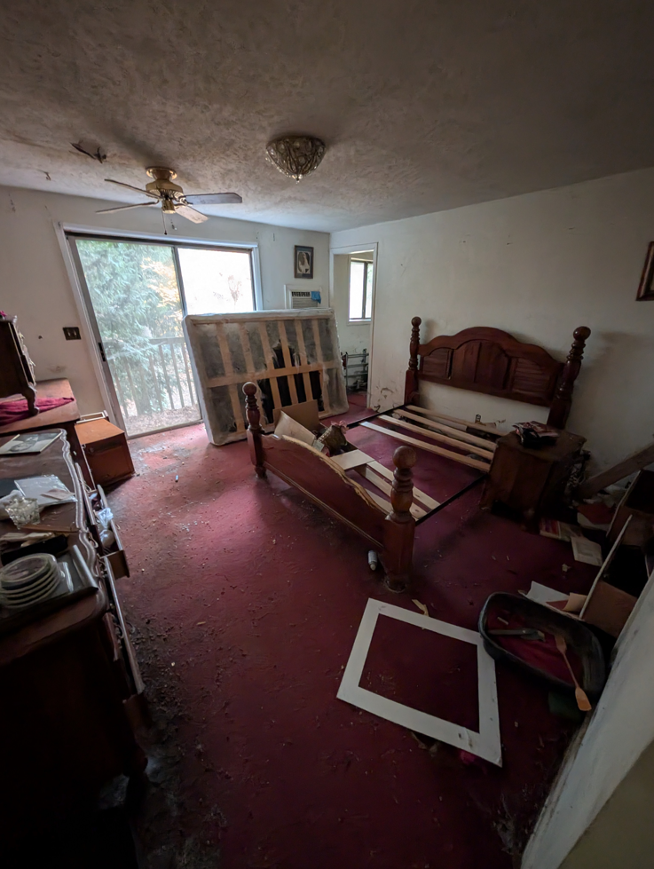 A bedroom with disassembled furniture and a mattress, showing items ready for removal by Patriot Hauling & Junk Removal LLC in Salem, OR.