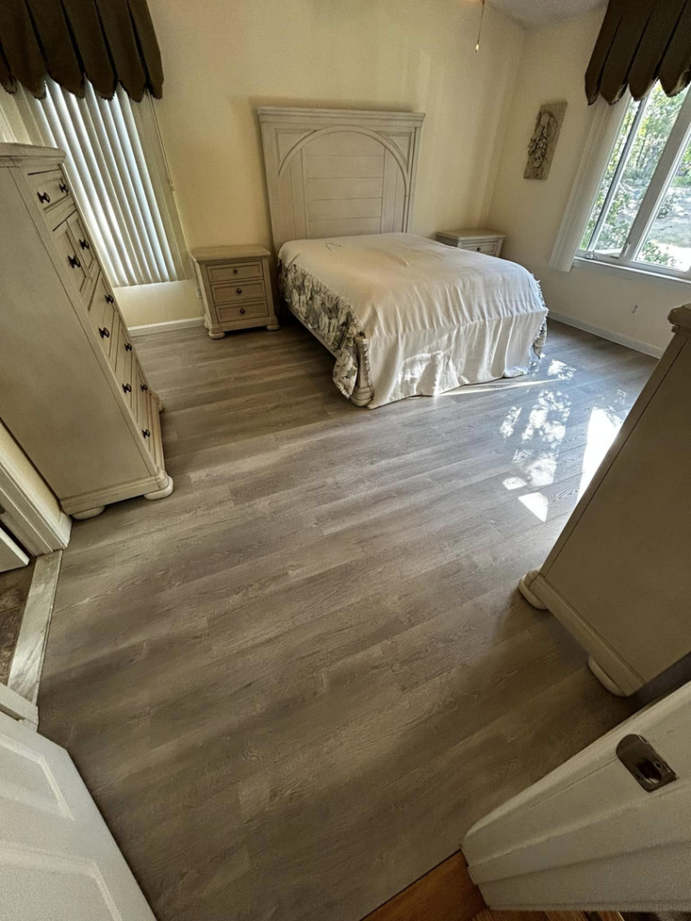 Bedroom featuring newly installed LVP flooring by Kings Handyman Services in Dallas, TX