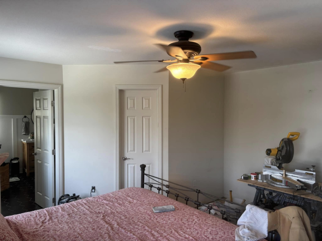 A bedroom renovation in progress with tools visible, managed by MLJ Construction and Design in Pittsburgh, PA