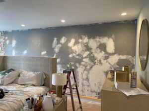 Bedroom wall with drywall patching and mudding in progress, preparing for finishing by Sal Handyman Services in Canyon Country, CA