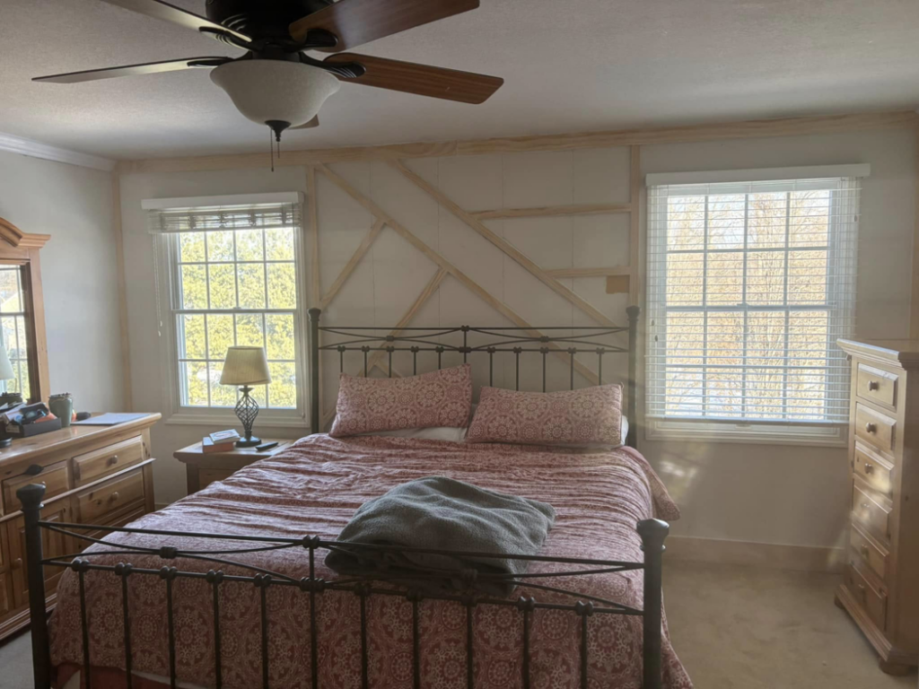 Installation of decorative wall paneling in a bedroom by MLJ Construction and Design in Pittsburgh, PA