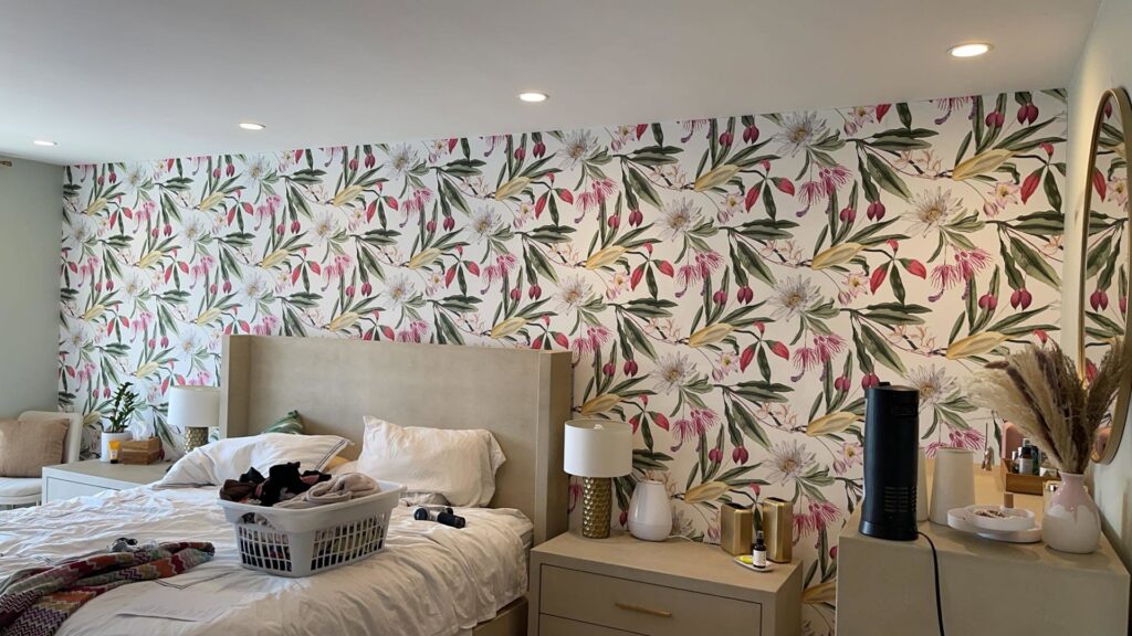 A bedroom featuring newly installed floral wallpaper as part of a renovation by Sal Handyman Services in Canyon Country, CA
