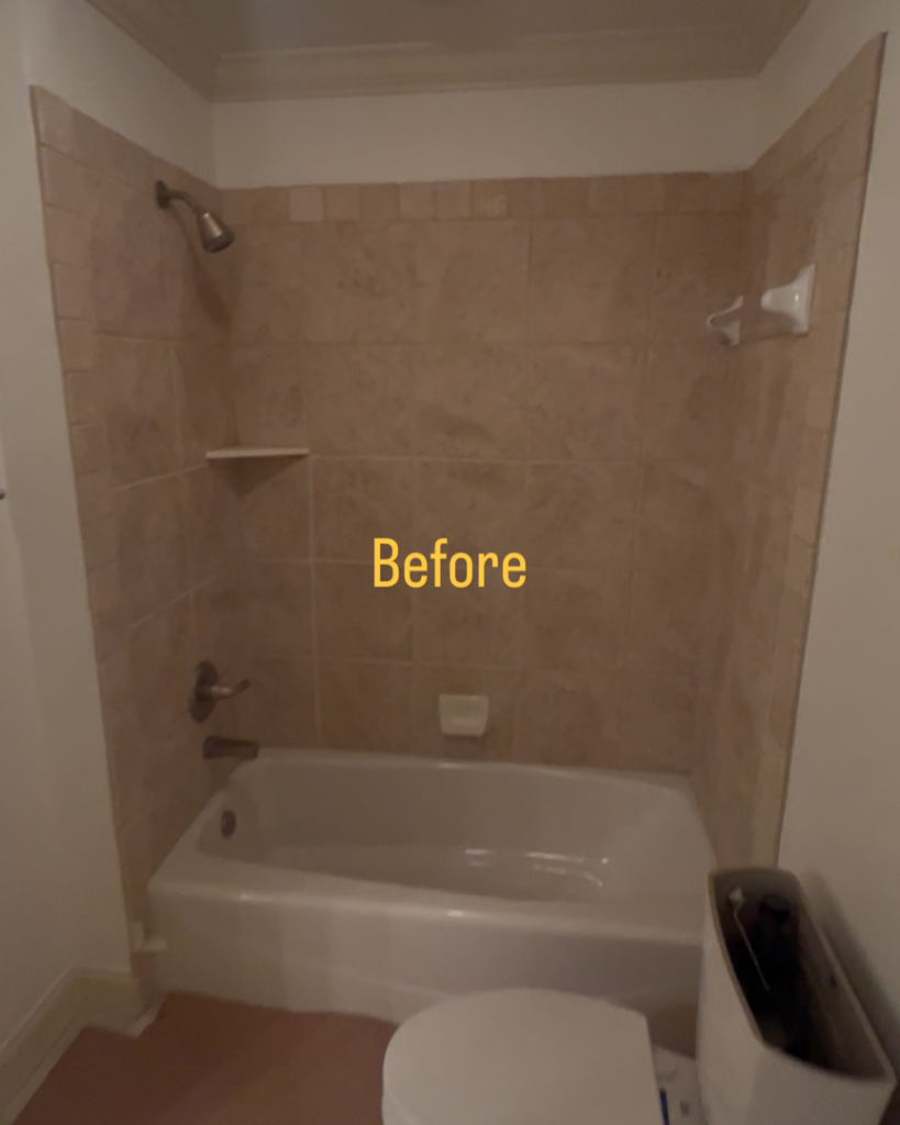 A 'before' view of an old bathroom with a bathtub and tiled walls, ready for a renovation project by TileWorks in Birmingham, AL.