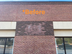 Before photo of a commercial building with faded brick, ready for staining by East Coast Brick Staining in Raleigh, NC.