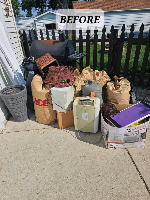 A pile of old grill, baskets, and electronics on a patio before junk removal by Mike And Nick's Removal Service in Milwaukee, WI