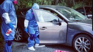 Biohazard PRO specialists in protective gear performing car cleanup and junk removal in Boston, MA.