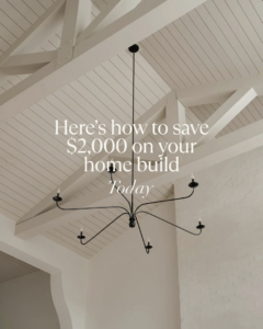 A modern black chandelier hanging from a vaulted ceiling, showcasing light fixture installation by Wiersma Homes in Knoxville, TN.