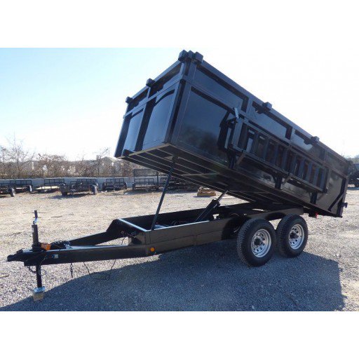 A black dump trailer with its bed raised, used for junk hauling and debris removal by Mr. Property Service in Sanford, ME.