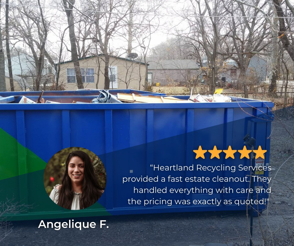 A blue dumpster filled with various junk and debris from an estate cleanout by Heartland Recycling Services in Portland, OR.