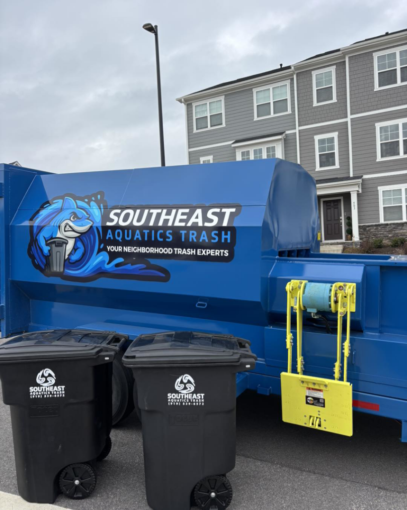 A blue garbage truck and two trash bins from Southeast Aquatics Trash in Raleigh, NC.