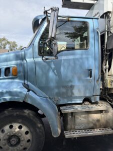 A close-up of the blue waste collection truck cab, showing "WICHITA KS" details for Allen and Sons Waste Services.