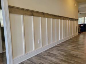 Stylish board and batten wall paneling with wood trim installed by A Man Who Can LLC in Milford, DE.