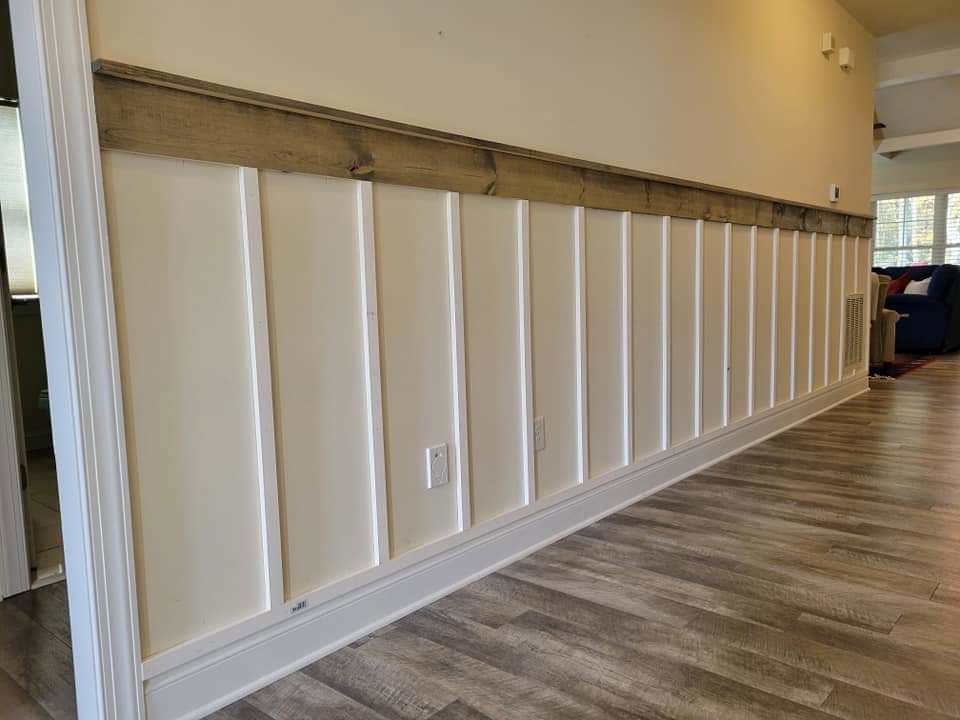 Stylish board and batten wall paneling with wood trim installed by A Man Who Can LLC in Milford, DE.