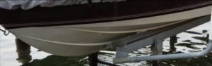 A boat securely resting on a boat lift installed by Walks On Water, Inc in Clear Lake, MN